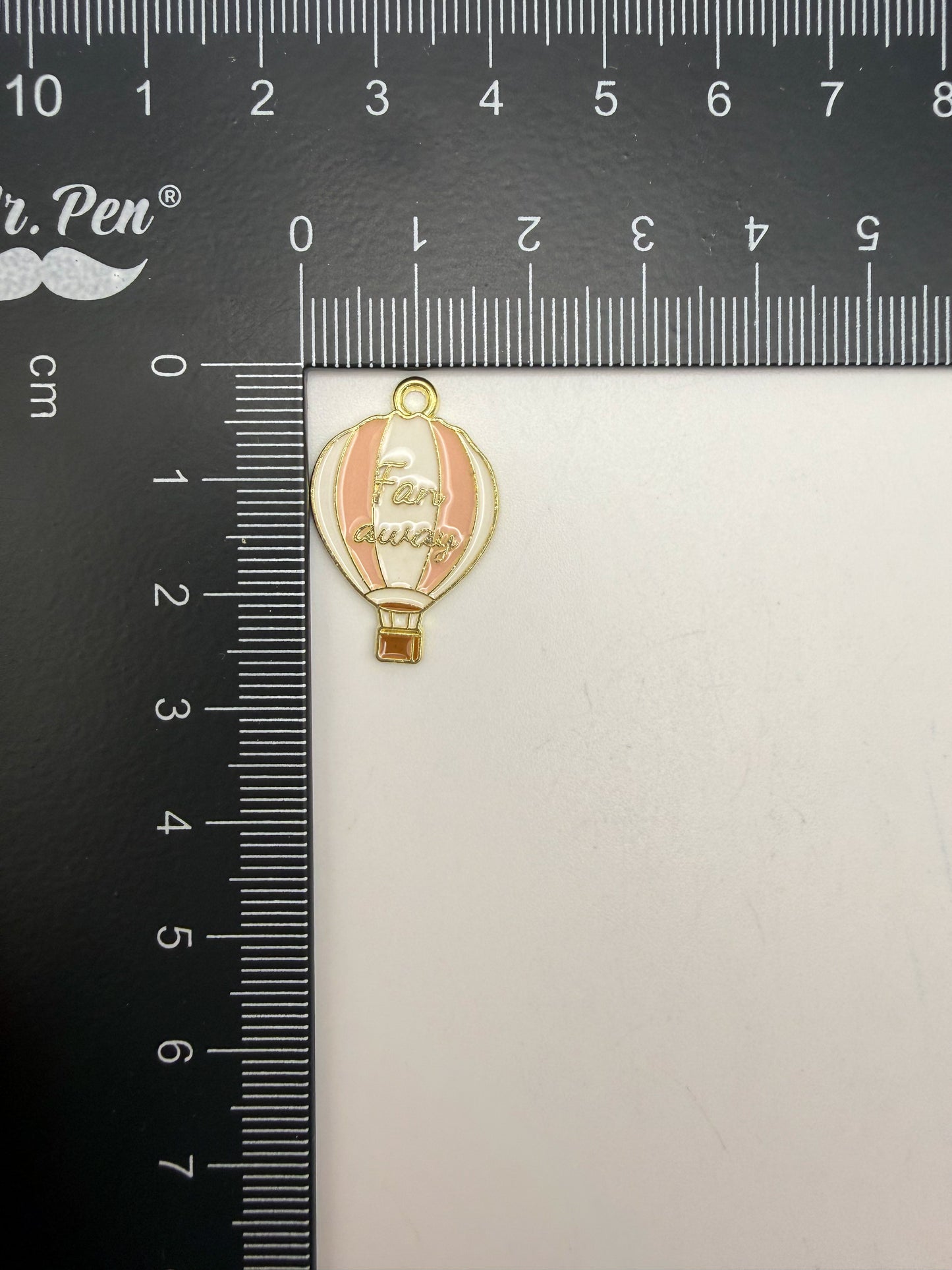 Gold Hot Air Balloon Metal Charm with saying ‘Far Away’