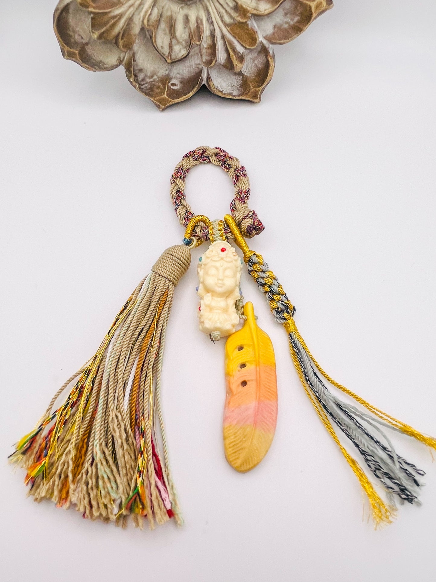 Ivory Nut Budda Carving with Feather on Handmade Tassel Keychain