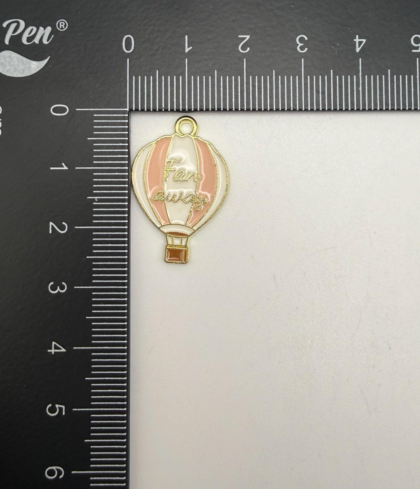 Gold Hot Air Balloon Metal Charm with saying ‘Far Away’